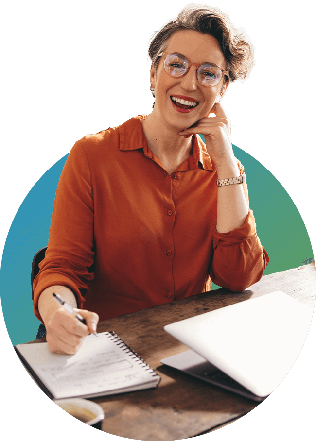 Woman smiling while sitting at a desk